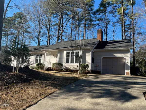 a front view of a house with sitting space