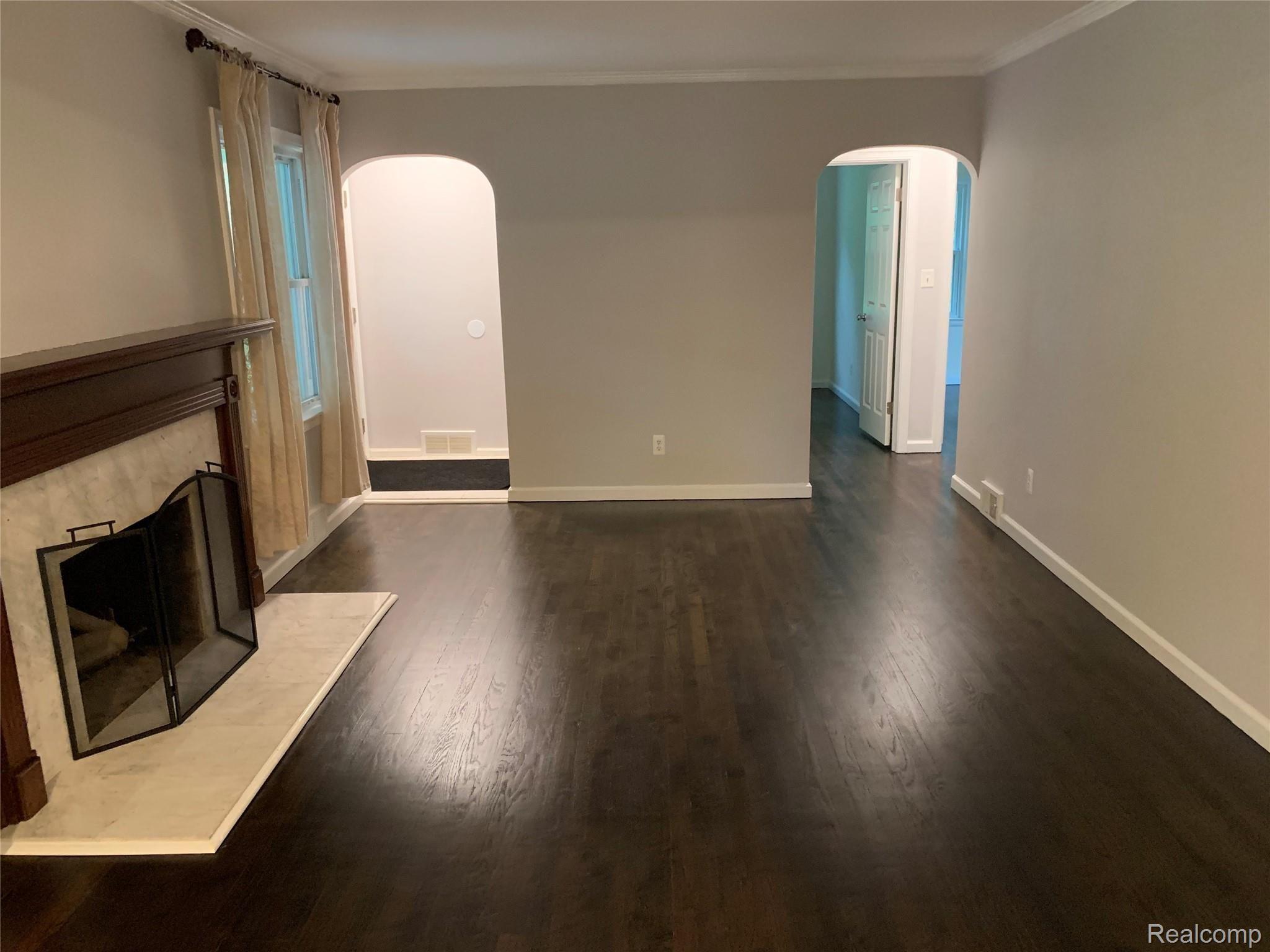 4859 Crooked Lake Road Howell, MI 48843 - Photo 21 of 90 Fresh Paint, Just Finished Hardwood, arched doorways, this home has tons of charm!