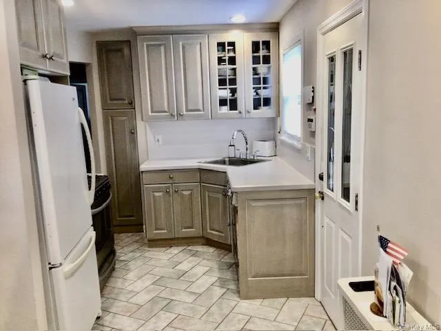 a utility room with cabinets washer and dryer