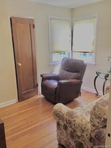 a bedroom with furniture and a window