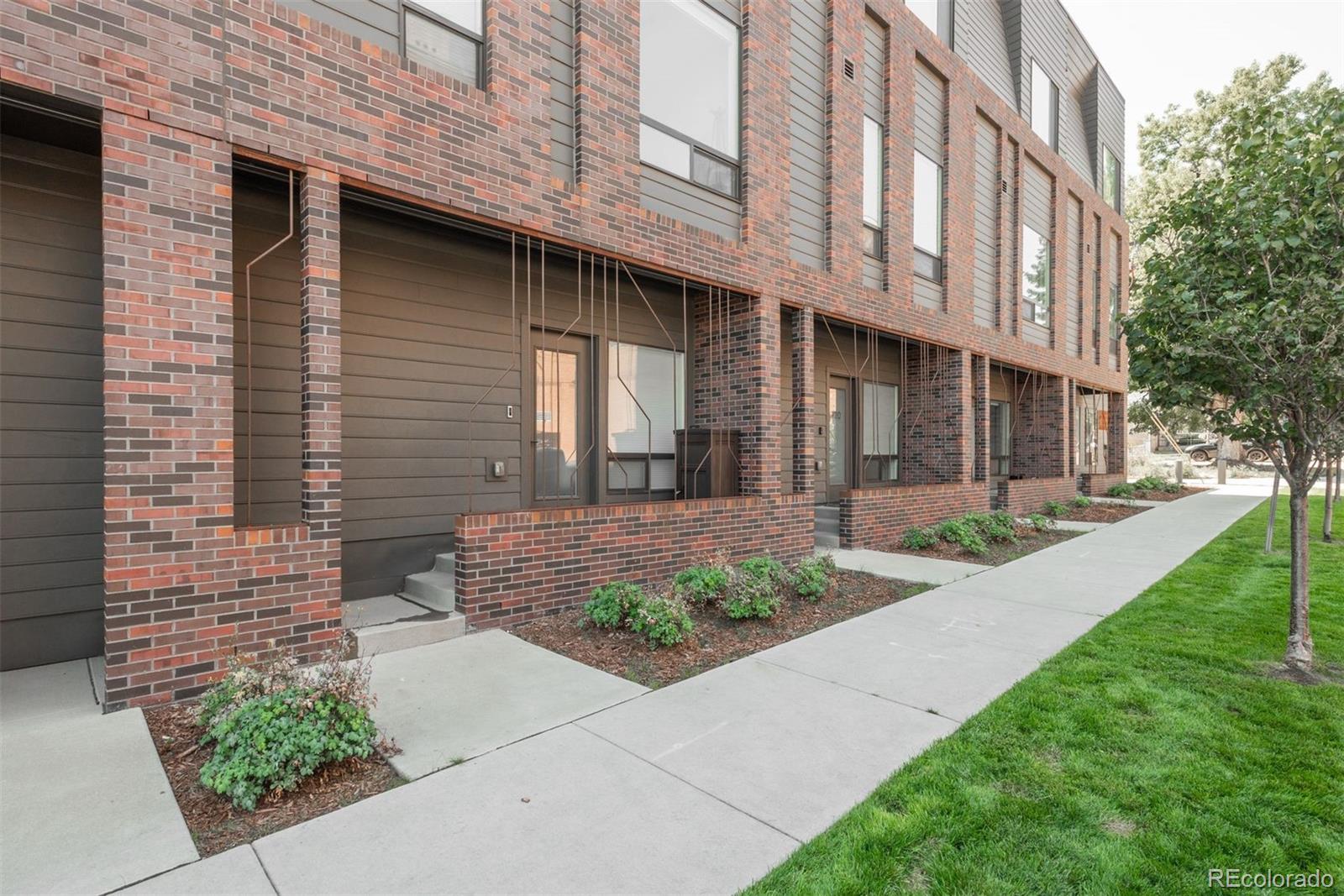 910 West 40th Avenue Denver, CO 80211 - Photo 1 of 33 a view of a brick building with many windows