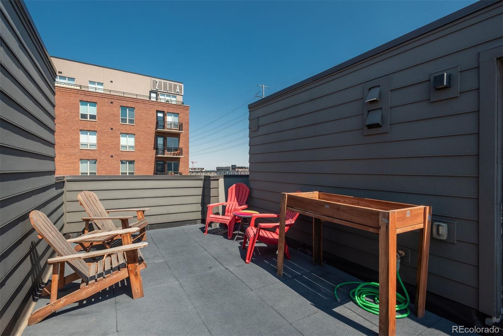910 West 40th Avenue Denver, CO 80211 - Photo 23 of 33 a view of a patio with a table and chairs
