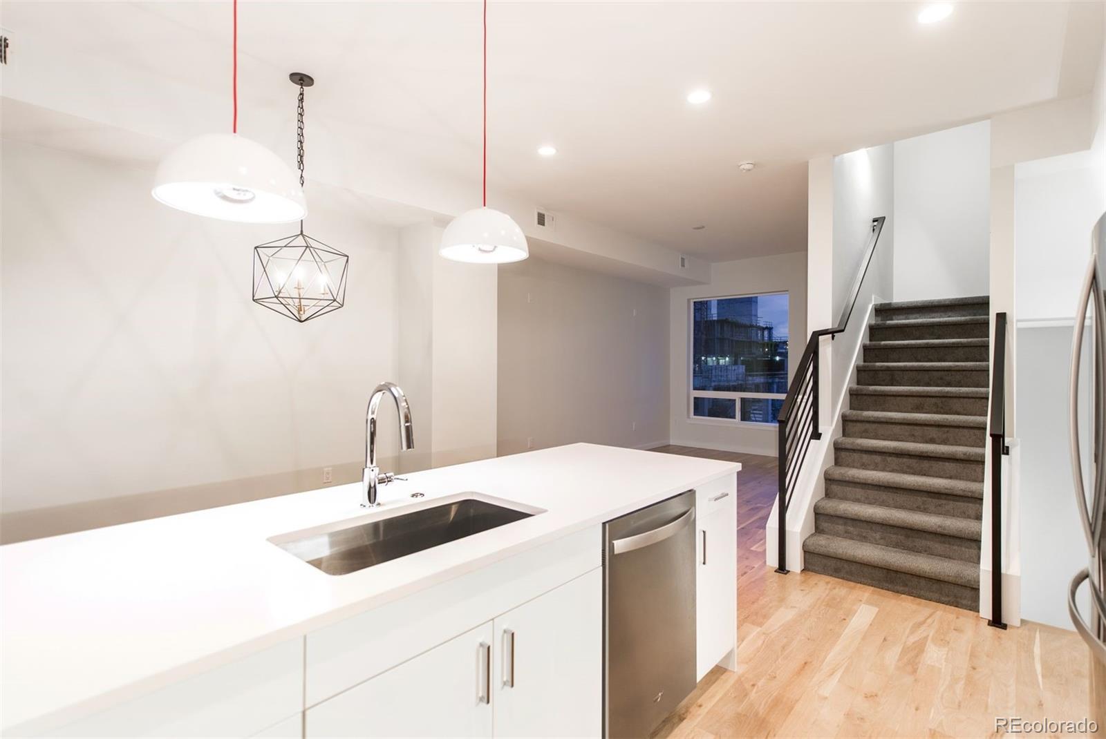 910 West 40th Avenue Denver, CO 80211 - Photo 28 of 33 a kitchen with a sink and a stove