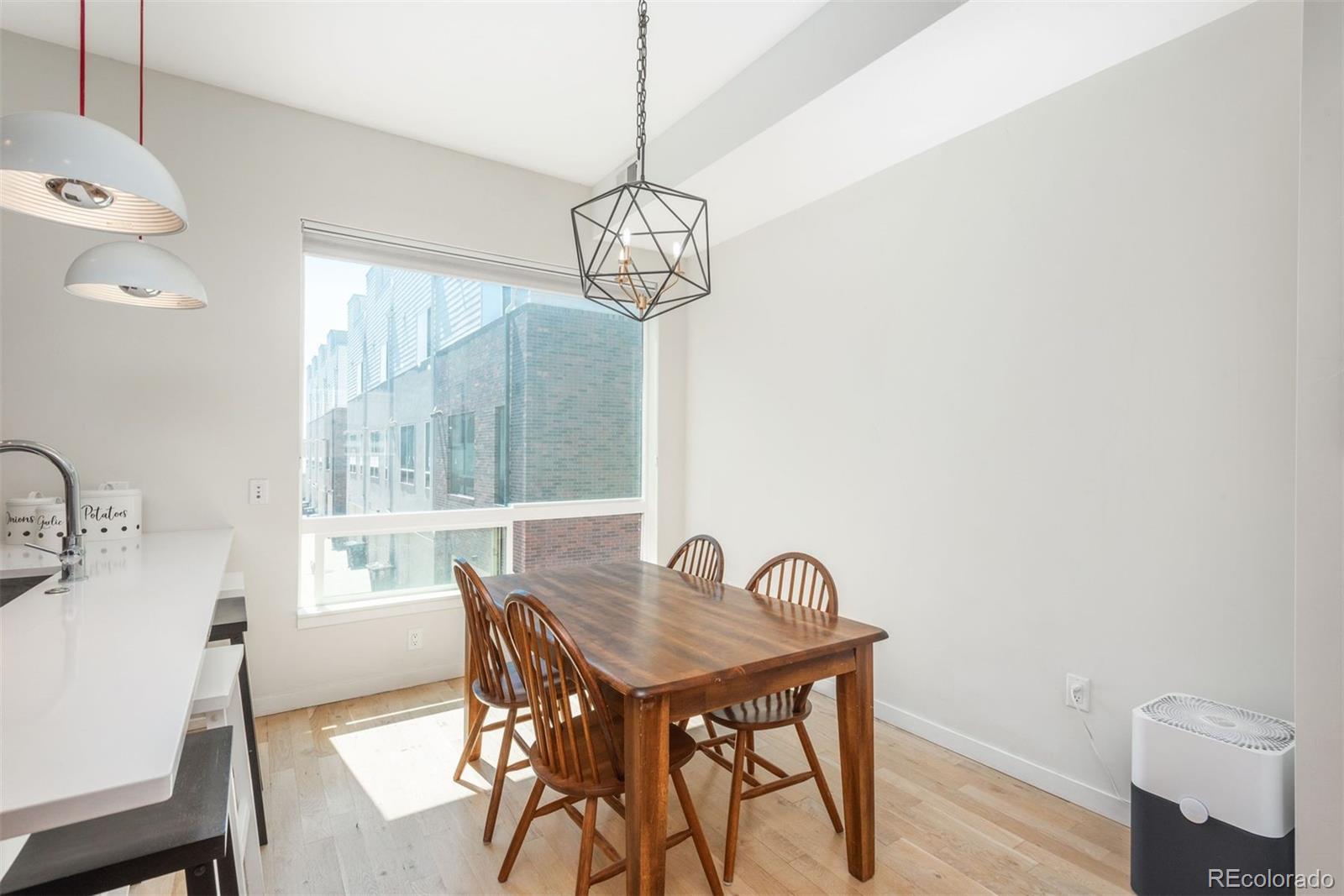 910 West 40th Avenue Denver, CO 80211 - Photo 7 of 33 a dining room with furniture and window