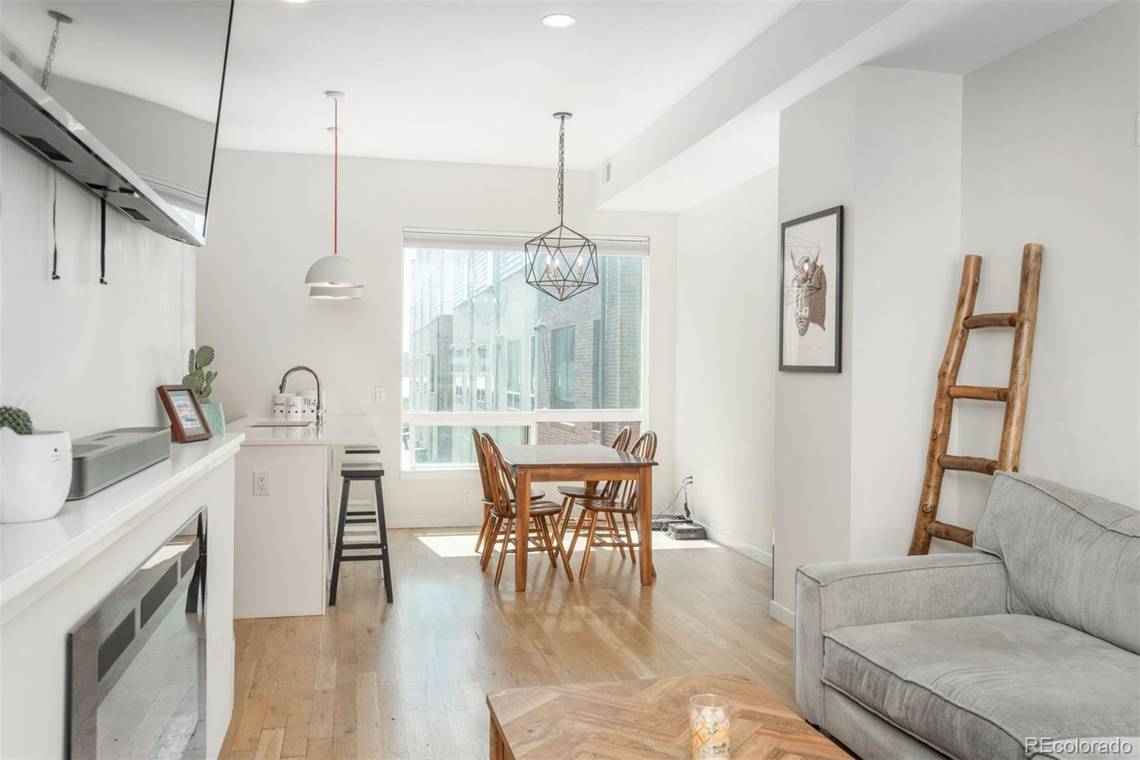 910 West 40th Avenue Denver, CO 80211 - Photo 9 of 33 a dining room with furniture window wooden floor