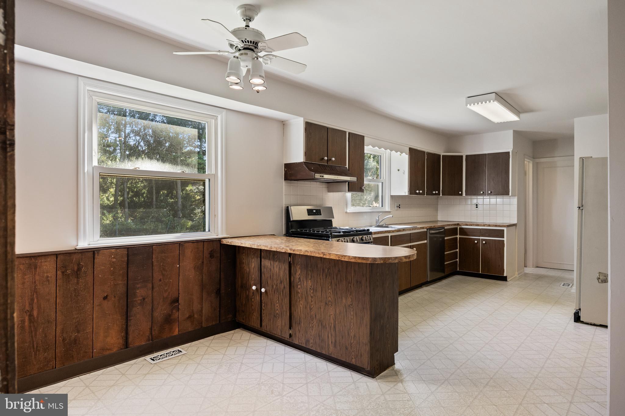 602 Wellfleet Road Cinnaminson, NJ 08077 - Photo 15 of 35 a kitchen with stainless steel appliances granite countertop a stove top oven a sink dishwasher a refrigerator and a microwave
