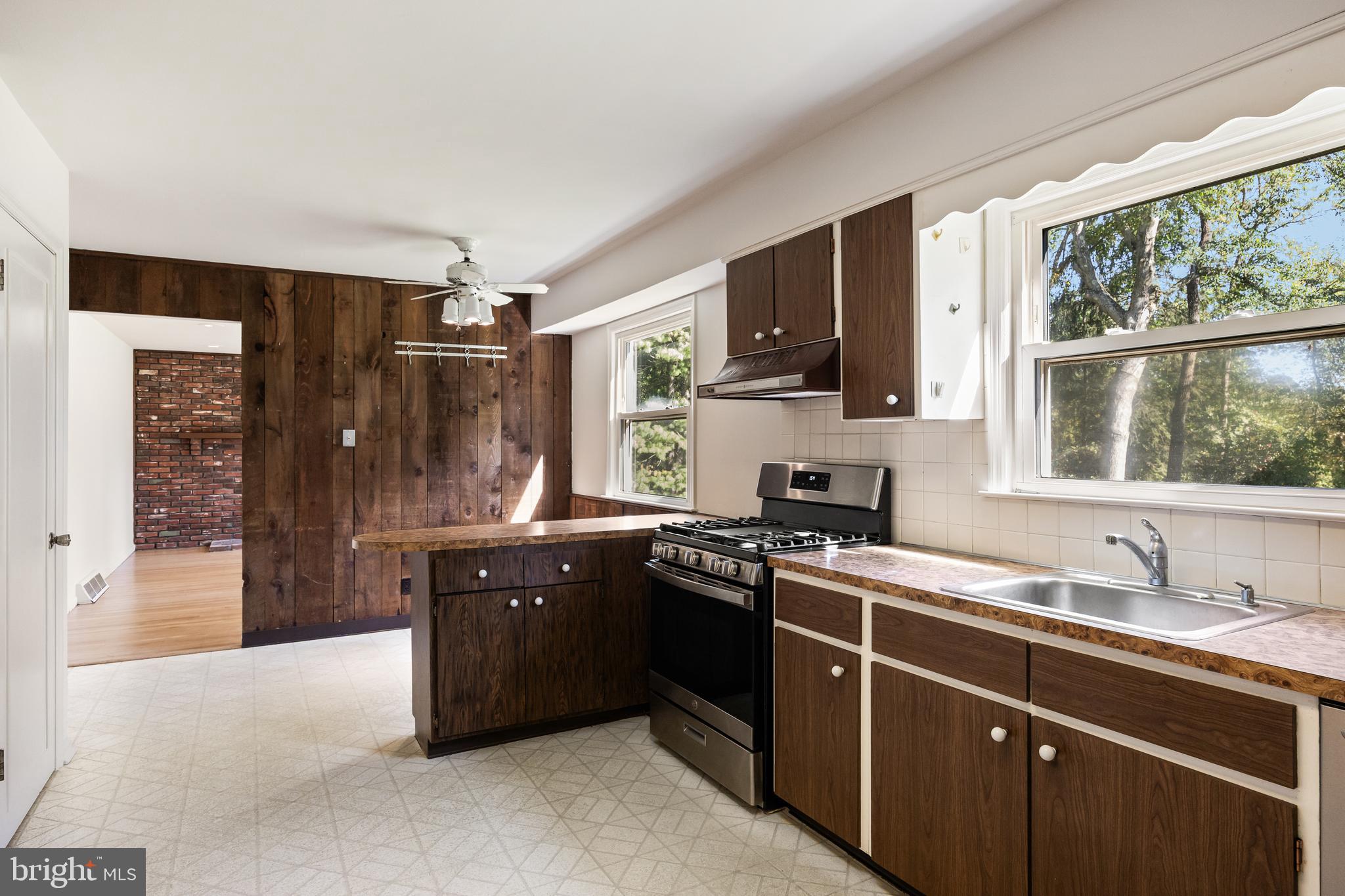 602 Wellfleet Road Cinnaminson, NJ 08077 - Photo 19 of 35 a kitchen with stainless steel appliances granite countertop a sink stove and refrigerator