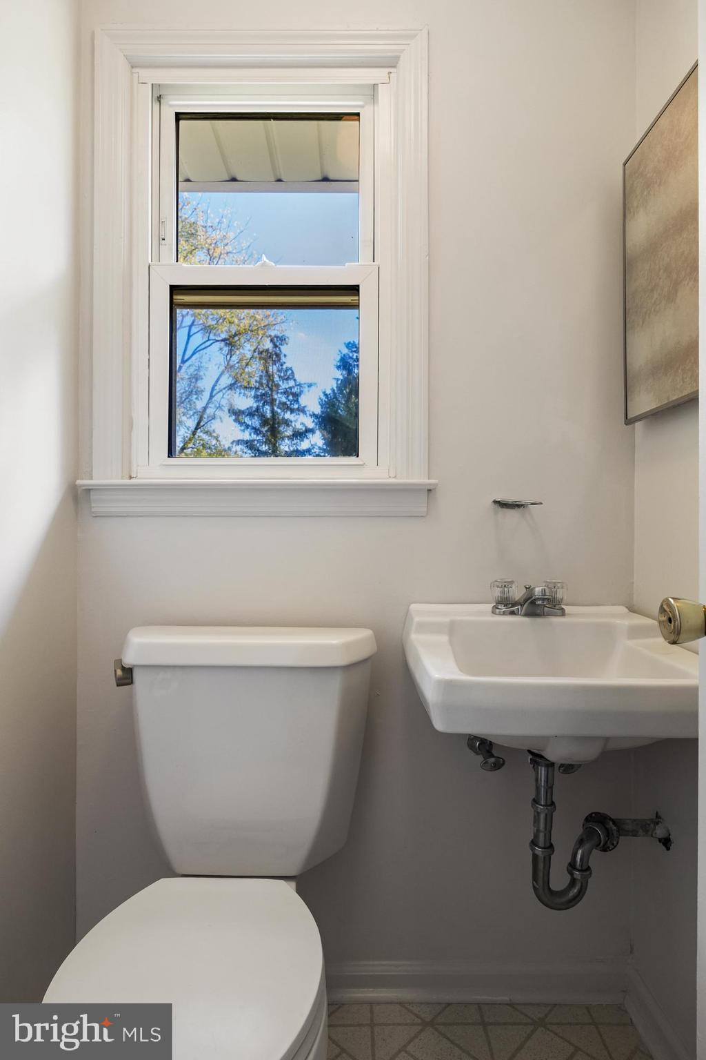 602 Wellfleet Road Cinnaminson, NJ 08077 - Photo 20 of 35 a white toilet sitting next to a bathroom sink