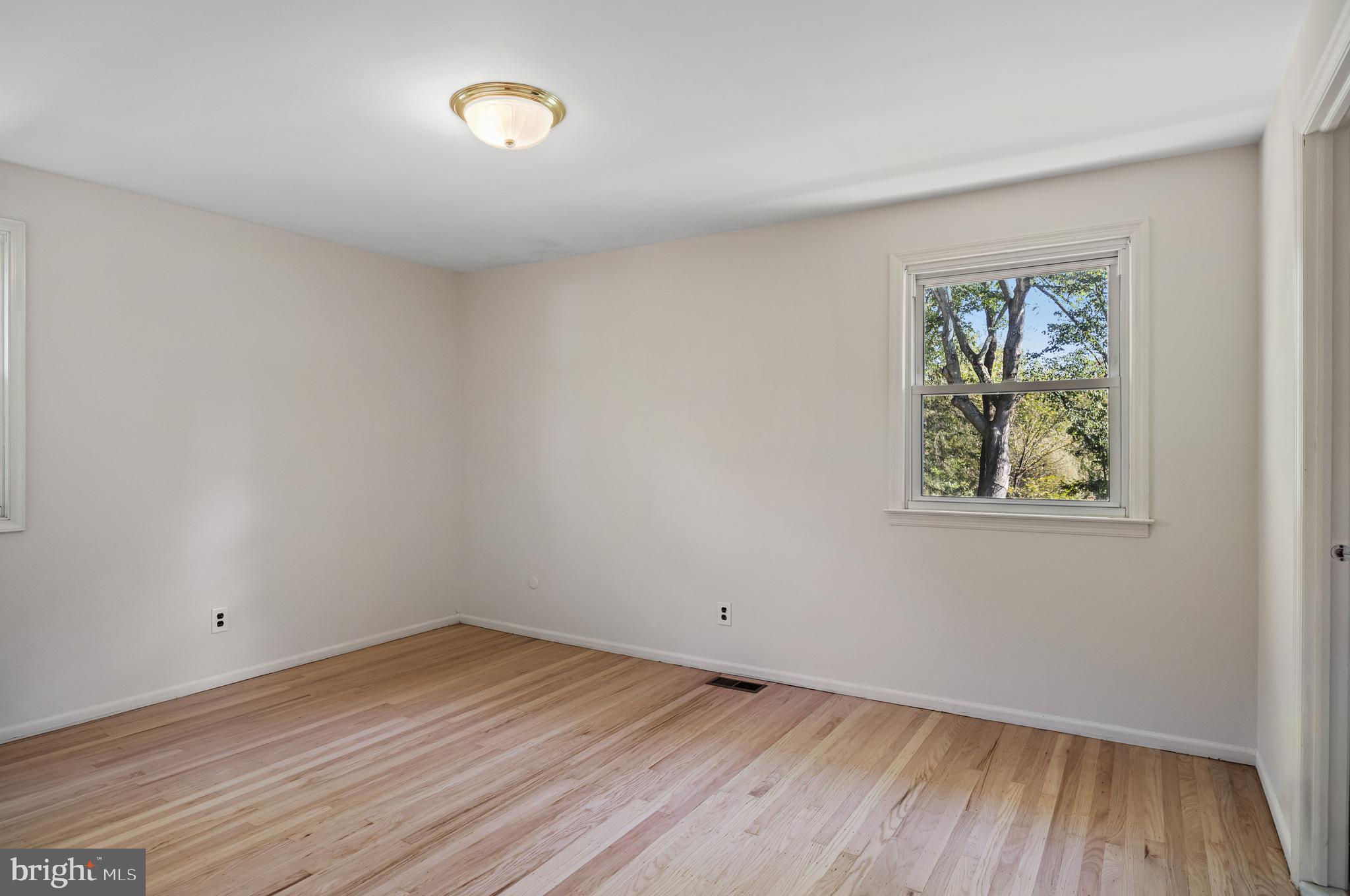 602 Wellfleet Road Cinnaminson, NJ 08077 - Photo 24 of 35 wooden floor in an empty room with a window