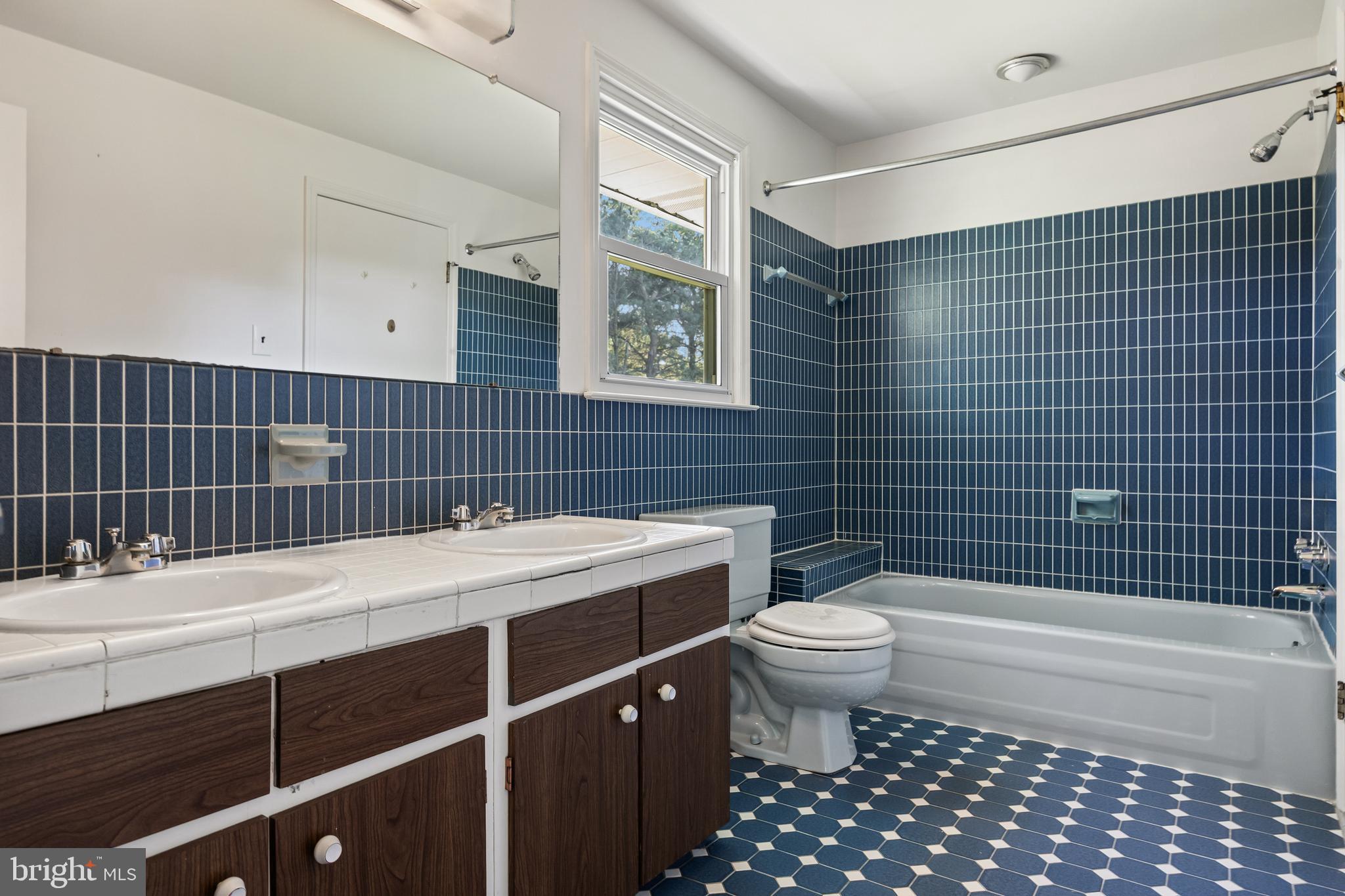 602 Wellfleet Road Cinnaminson, NJ 08077 - Photo 27 of 35 a bathroom with a sink a toilet and shower