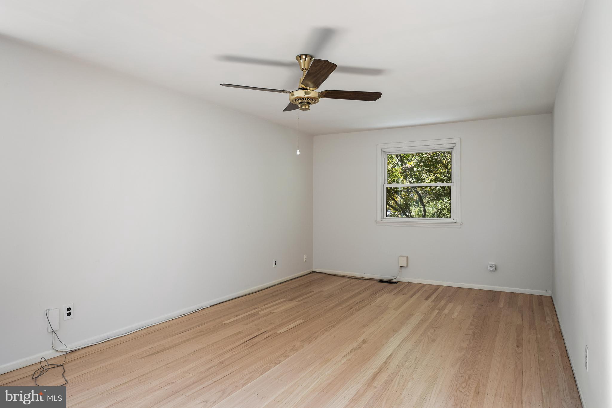 602 Wellfleet Road Cinnaminson, NJ 08077 - Photo 28 of 35 an empty room with a window and ceiling fan