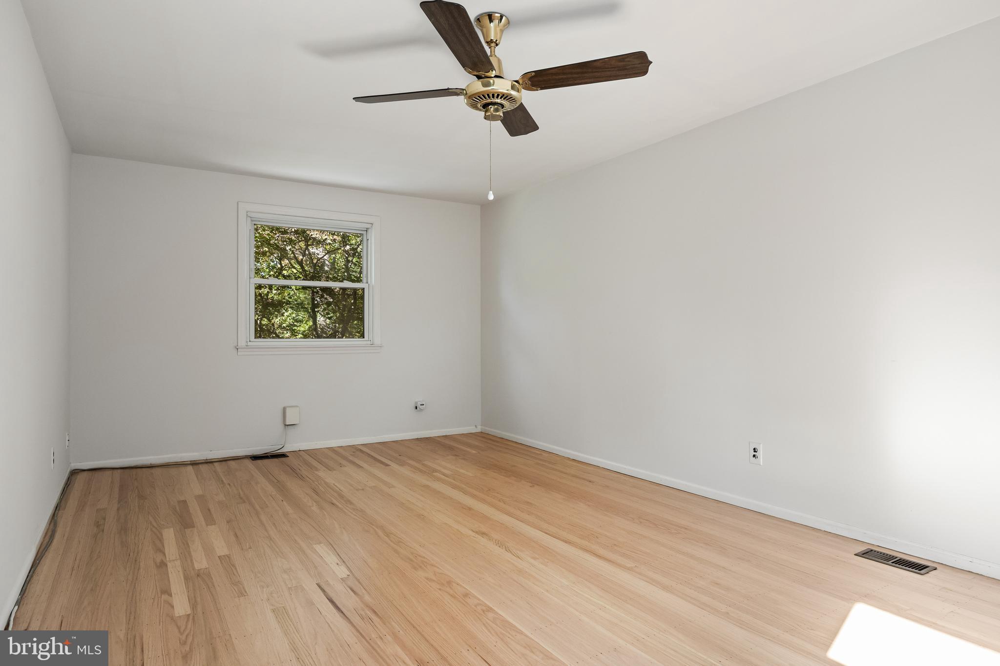 602 Wellfleet Road Cinnaminson, NJ 08077 - Photo 29 of 35 an empty room with a ceiling fan and window