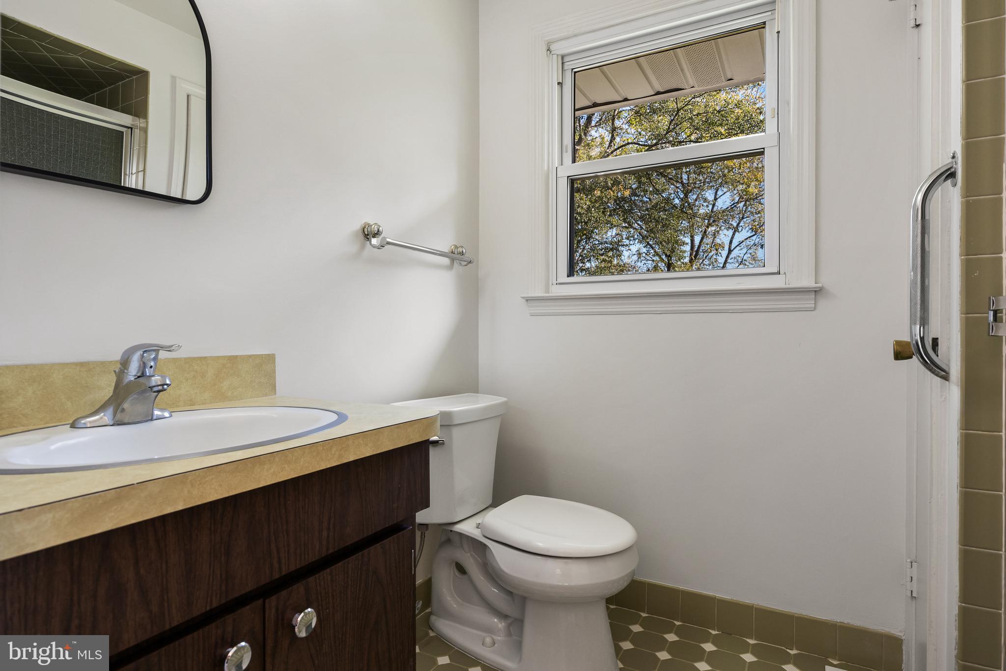 602 Wellfleet Road Cinnaminson, NJ 08077 - Photo 31 of 35 a bathroom with a sink a toilet and a window