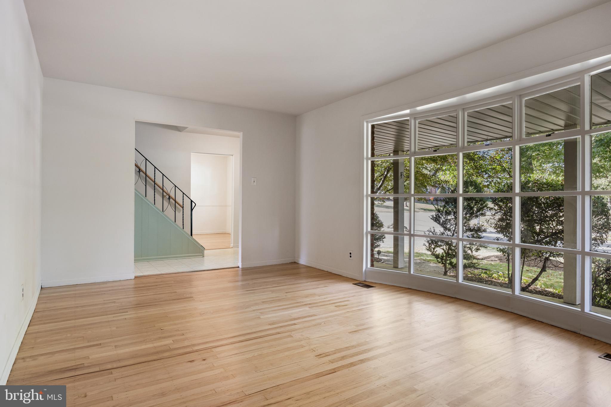 602 Wellfleet Road Cinnaminson, NJ 08077 - Photo 8 of 35 a view of an empty room with wooden floor and a window