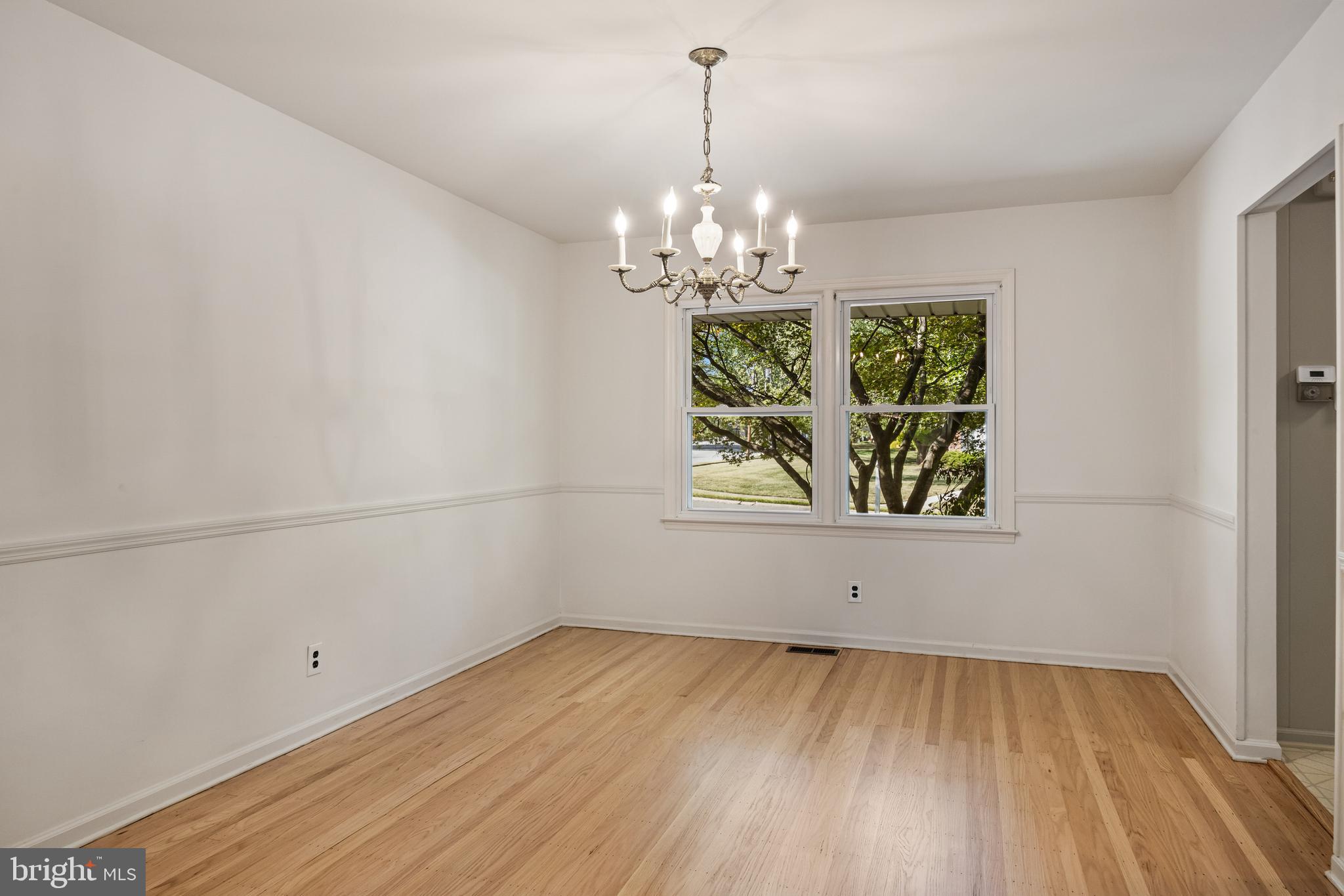 602 Wellfleet Road Cinnaminson, NJ 08077 - Photo 10 of 35 wooden floor in an empty room with a window