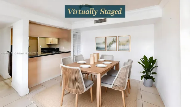 a view of a kitchen with a sink and an empty room