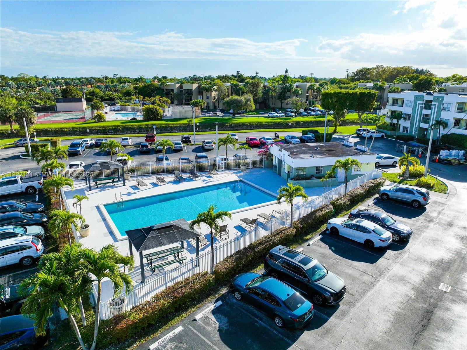 10765 Southwest 108th Avenue, Unit 208 Miami, FL 33176 - Photo 36 of 45 a view of a chairs and tables in the city