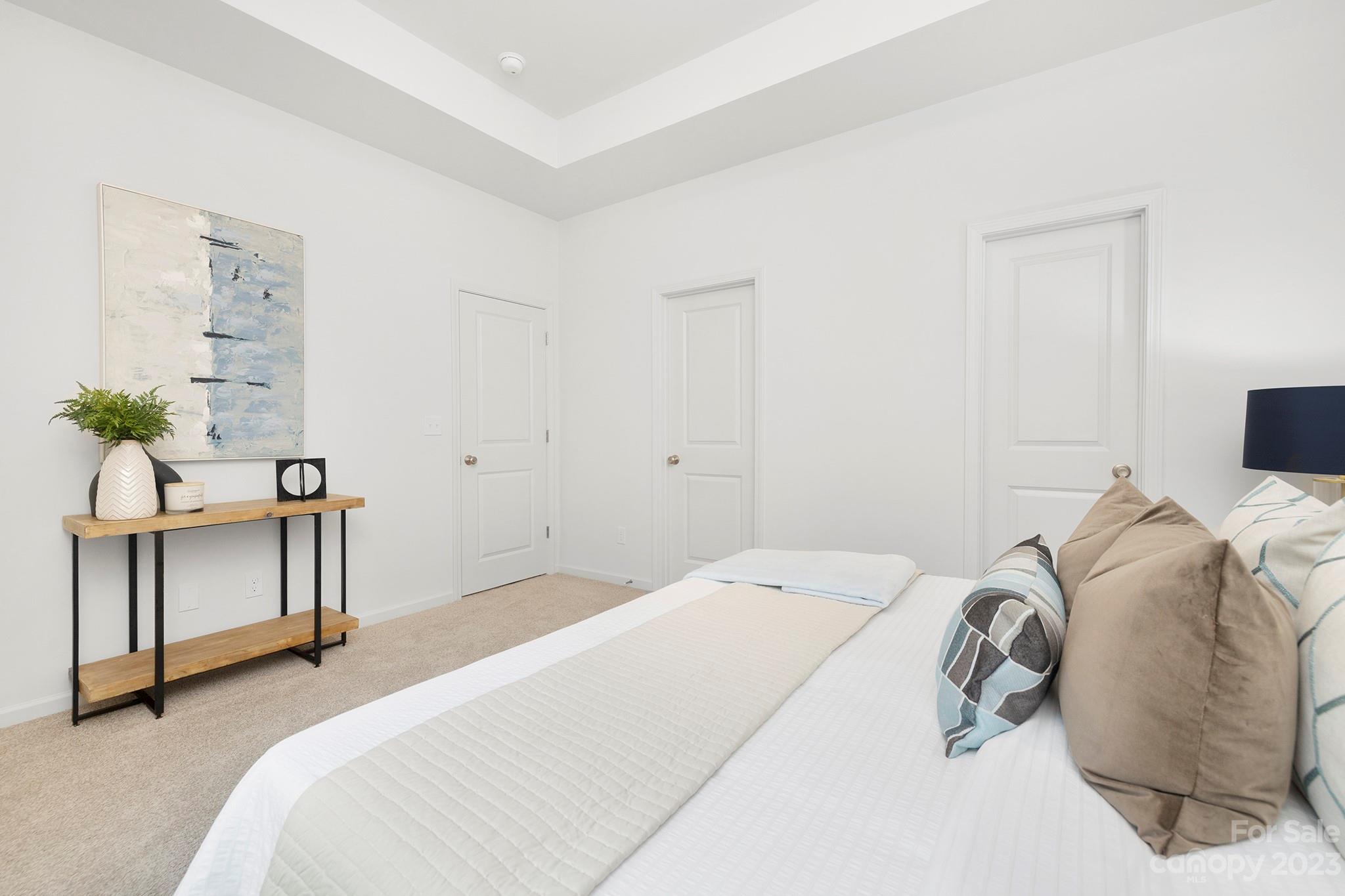 8725 Mt Holly Road Charlotte, NC 28214 - Photo 12 of 19 a bedroom with a bed and a table