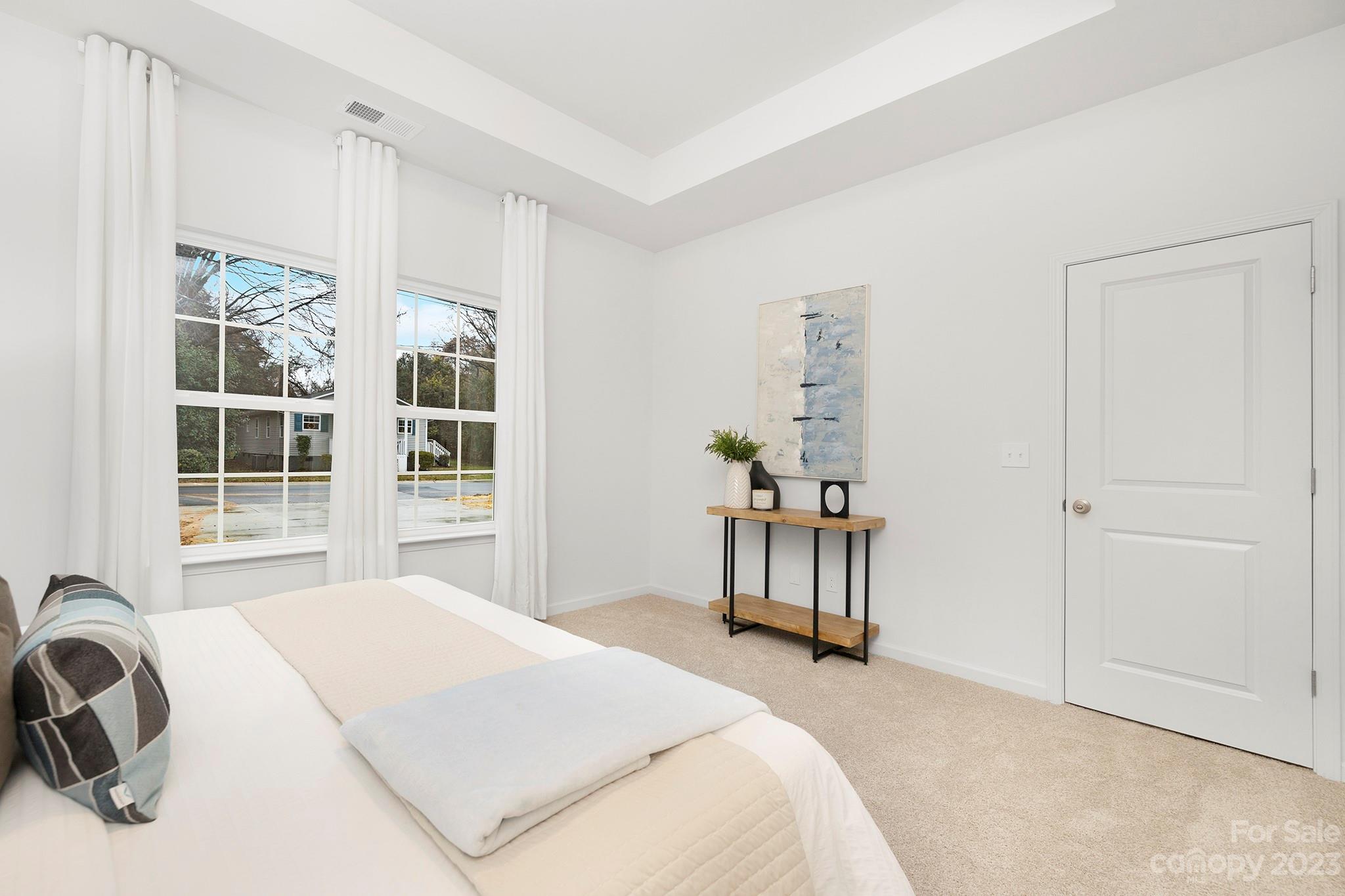 8725 Mt Holly Road Charlotte, NC 28214 - Photo 14 of 19 a bedroom with a bed and a window