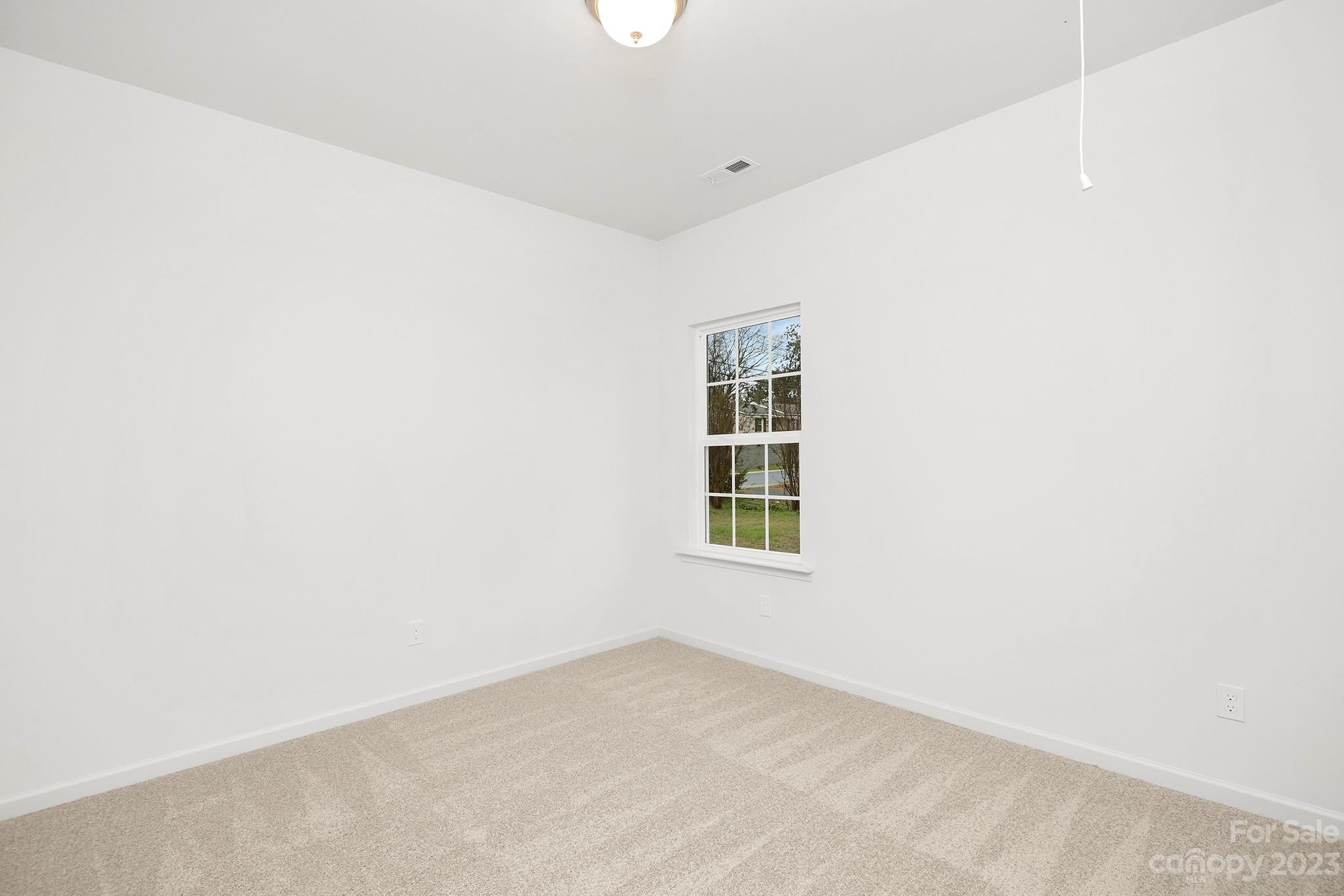 8725 Mt Holly Road Charlotte, NC 28214 - Photo 18 of 19 an empty room with a window