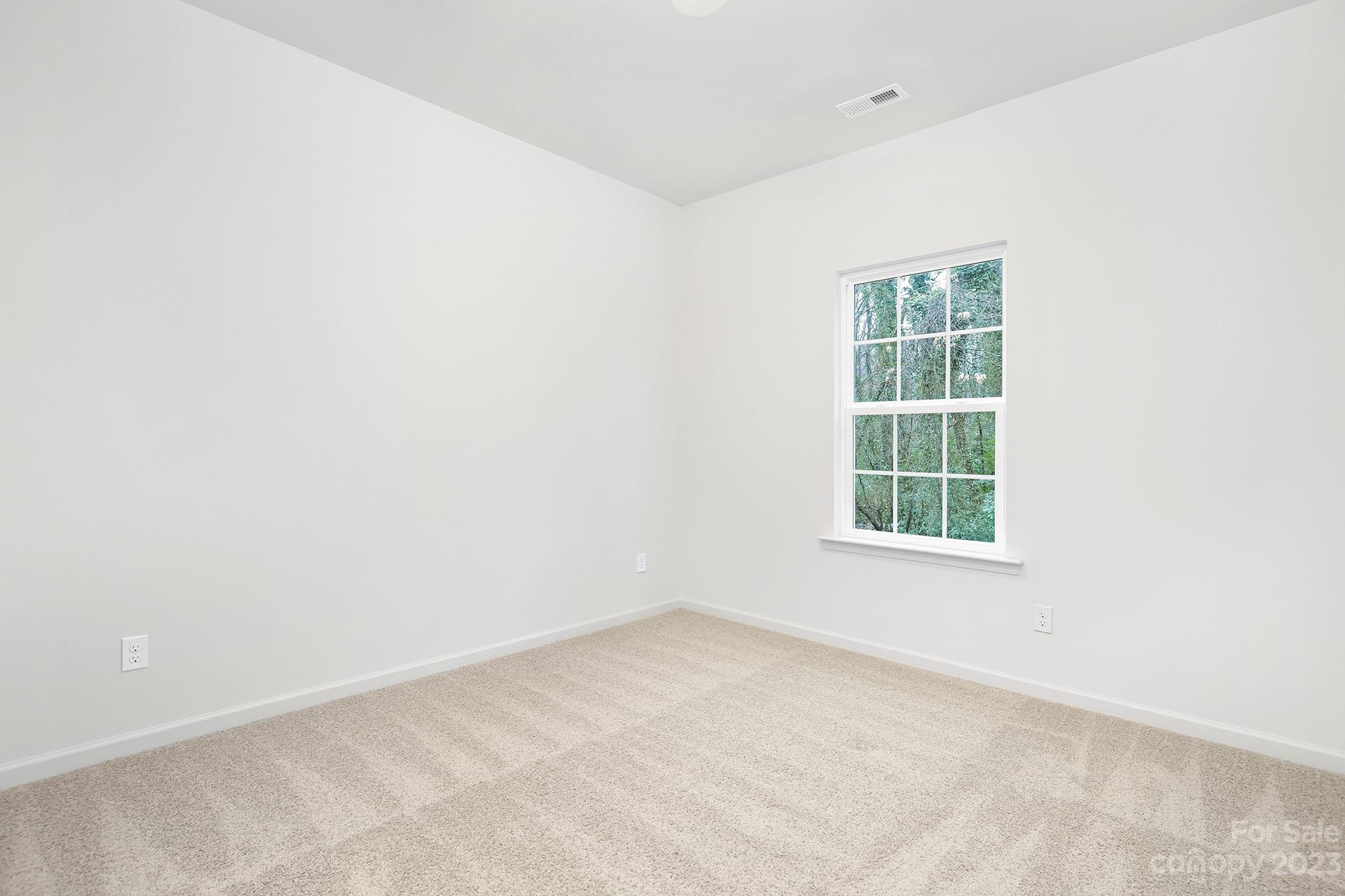 8725 Mt Holly Road Charlotte, NC 28214 - Photo 19 of 19 an empty room with a window