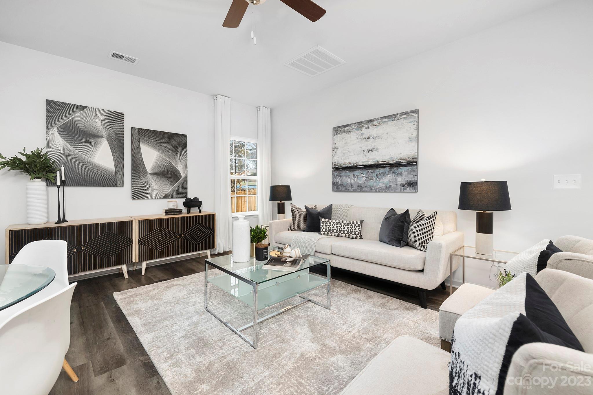 8725 Mt Holly Road Charlotte, NC 28214 - Photo 3 of 19 a living room with furniture and a large window