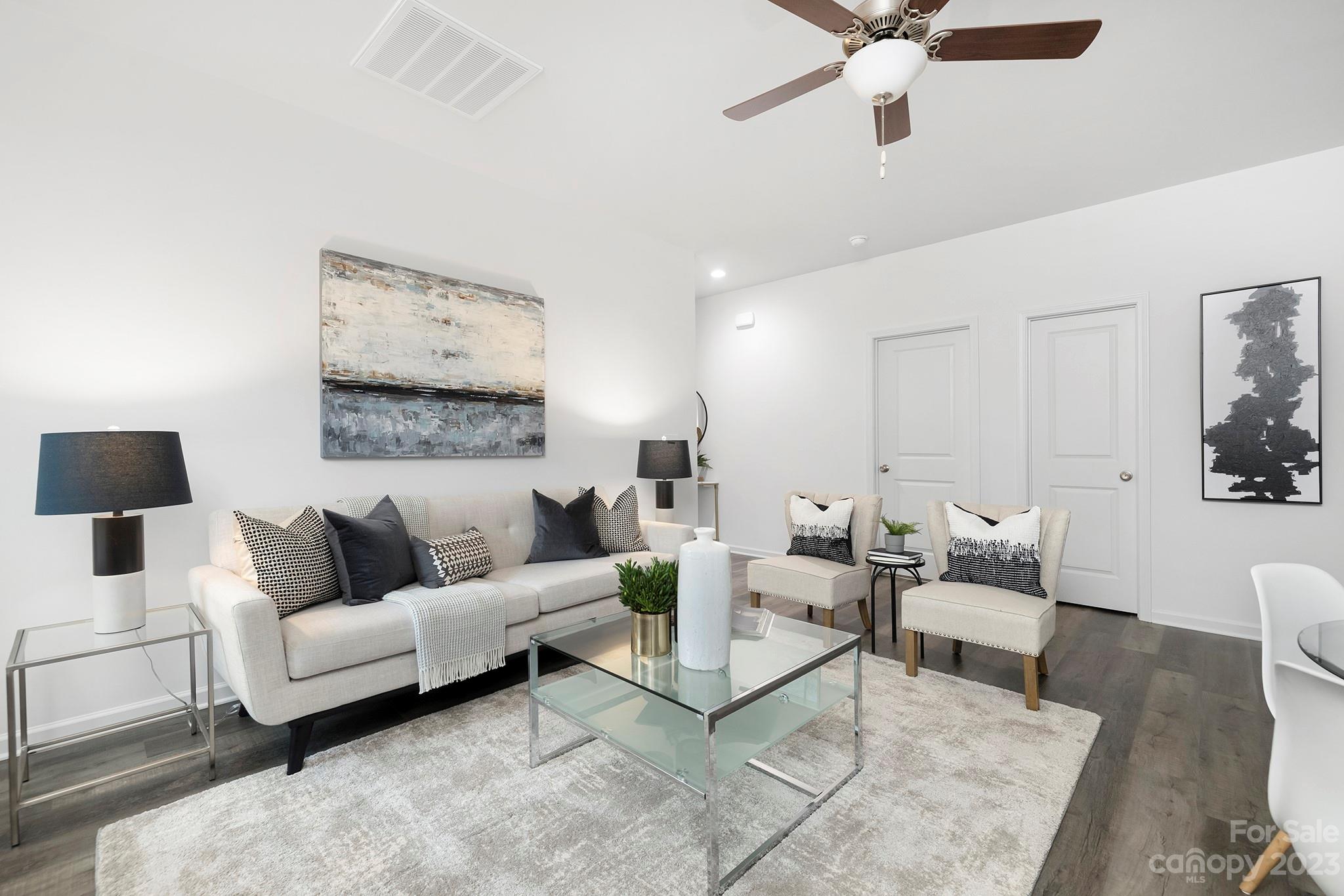 8725 Mt Holly Road Charlotte, NC 28214 - Photo 6 of 19 a living room with furniture and a wooden floor