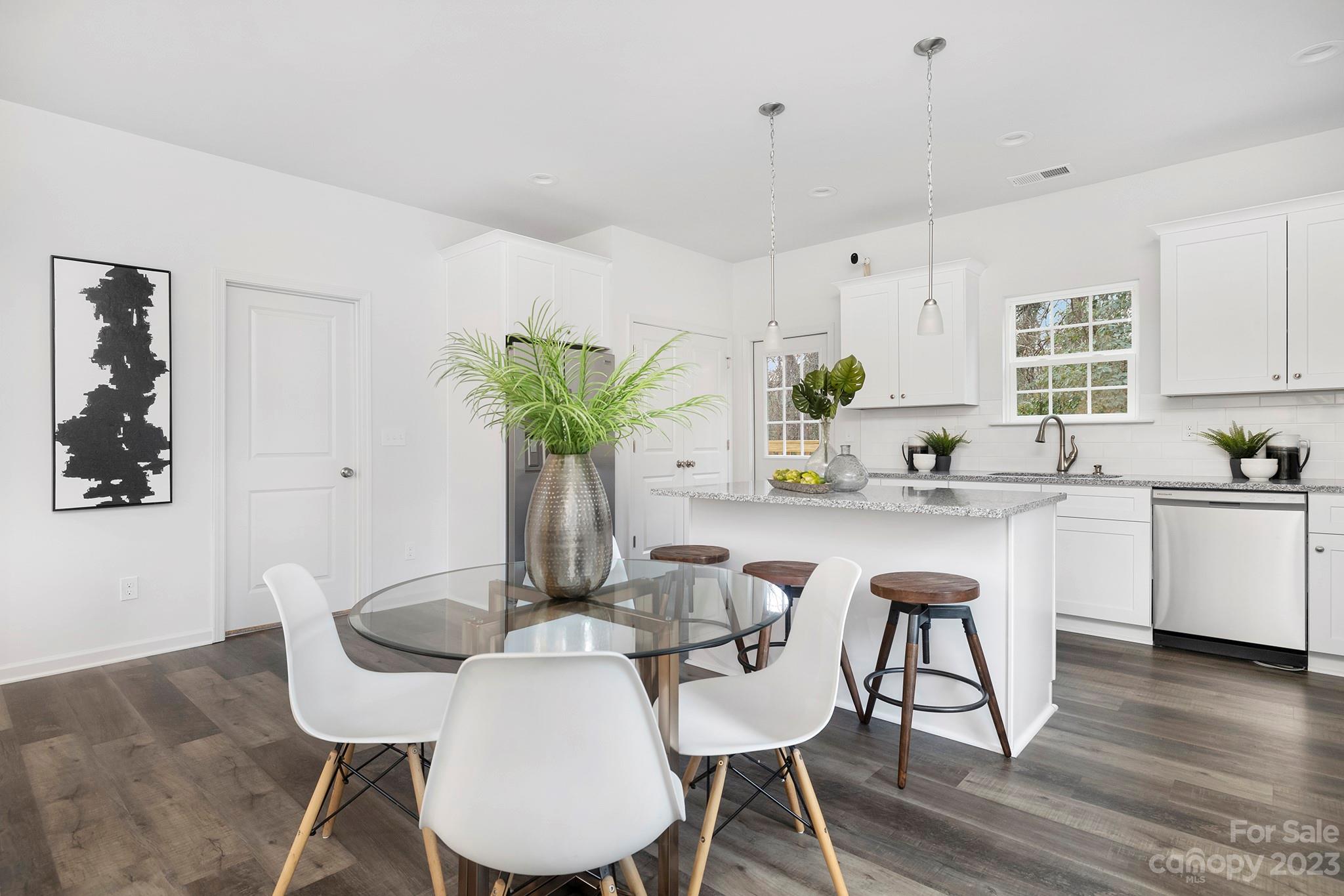 8725 Mt Holly Road Charlotte, NC 28214 - Photo 7 of 19 a kitchen with a table and chairs in it