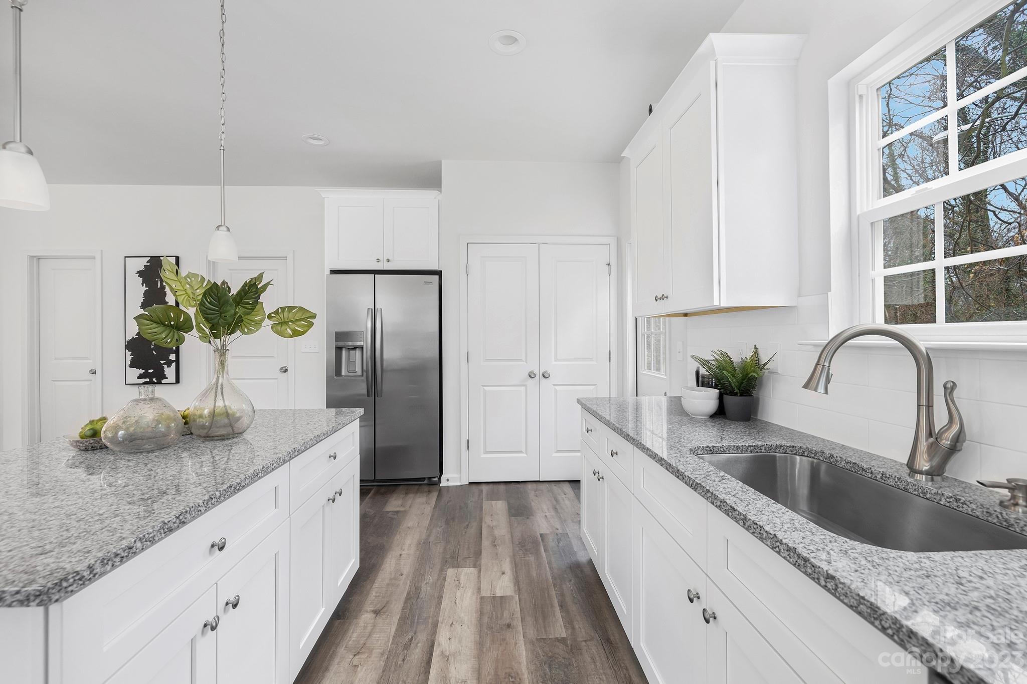 8725 Mt Holly Road Charlotte, NC 28214 - Photo 9 of 19 a kitchen with stainless steel appliances granite countertop a sink a counter space and cabinets