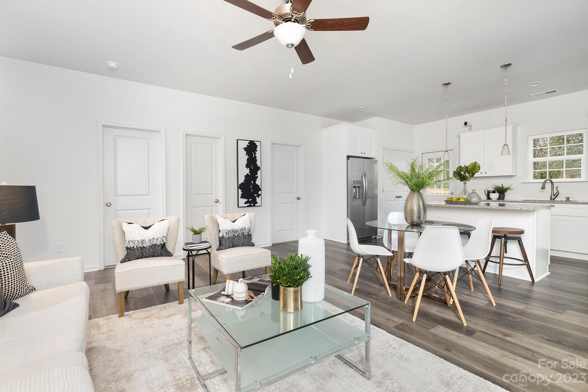 8725 Mt Holly Road Charlotte, NC 28214 - Photo 10 of 19 a living room with furniture and a wooden floor