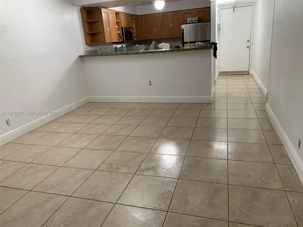 a kitchen with granite countertop a sink and a stove