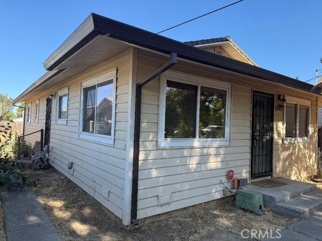1195 West Street Corning, CA 96021 - Photo 2 of 11 a view of a house with a small yard and wooden floor and fence