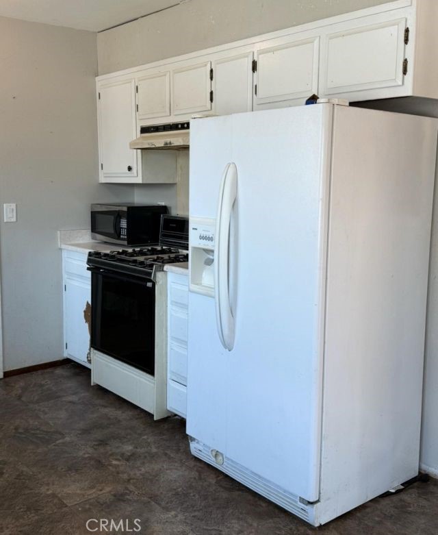 1195 West Street Corning, CA 96021 - Photo 5 of 11 a utility room with stainless steel appliances white cabinets and a refrigerator