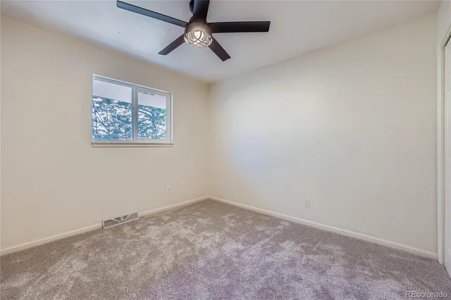 an empty room with a hallway