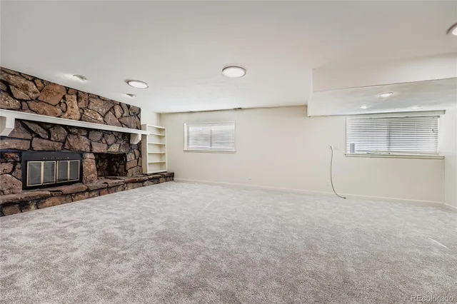 an empty room with a empty space and window