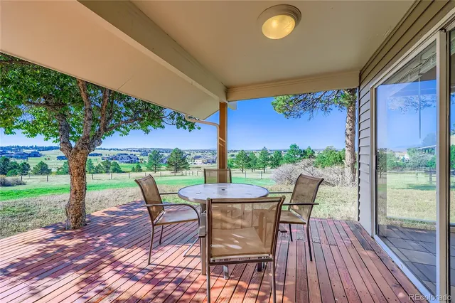 a view of a swimming pool and lounge chairs