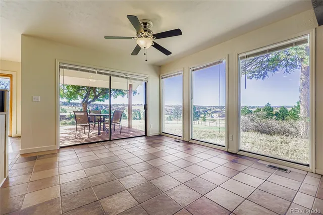 a view of outdoor space with wooden floor and windows