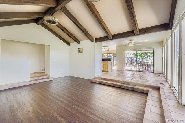 a view of room with wooden floor and window