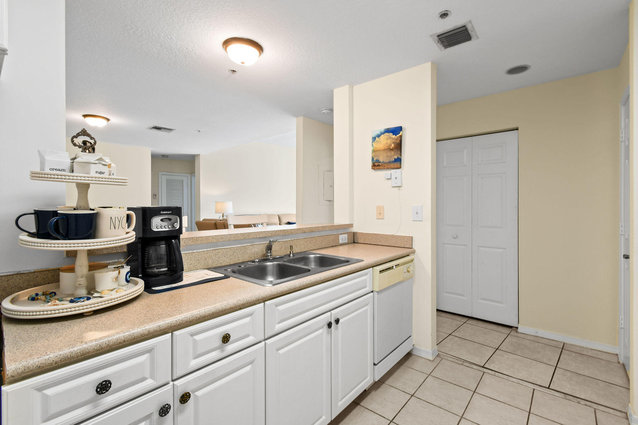 1200 Town Center Drive, Unit 326 Jupiter, FL 33458 - Photo 13 of 44 a kitchen with a sink and cabinets