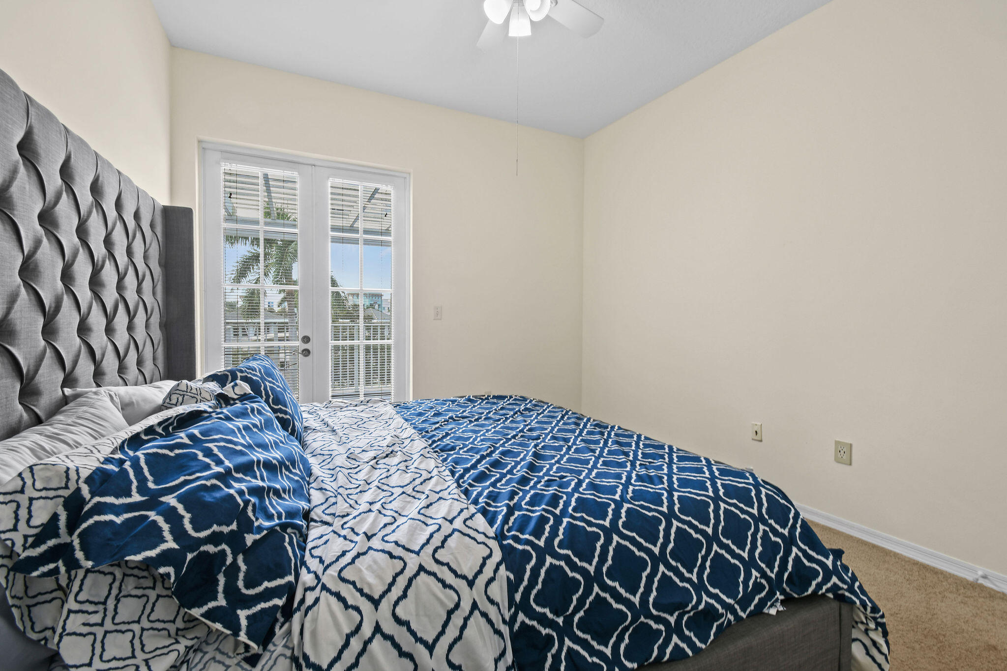 1200 Town Center Drive, Unit 326 Jupiter, FL 33458 - Photo 14 of 44 a bedroom with a bed and a window