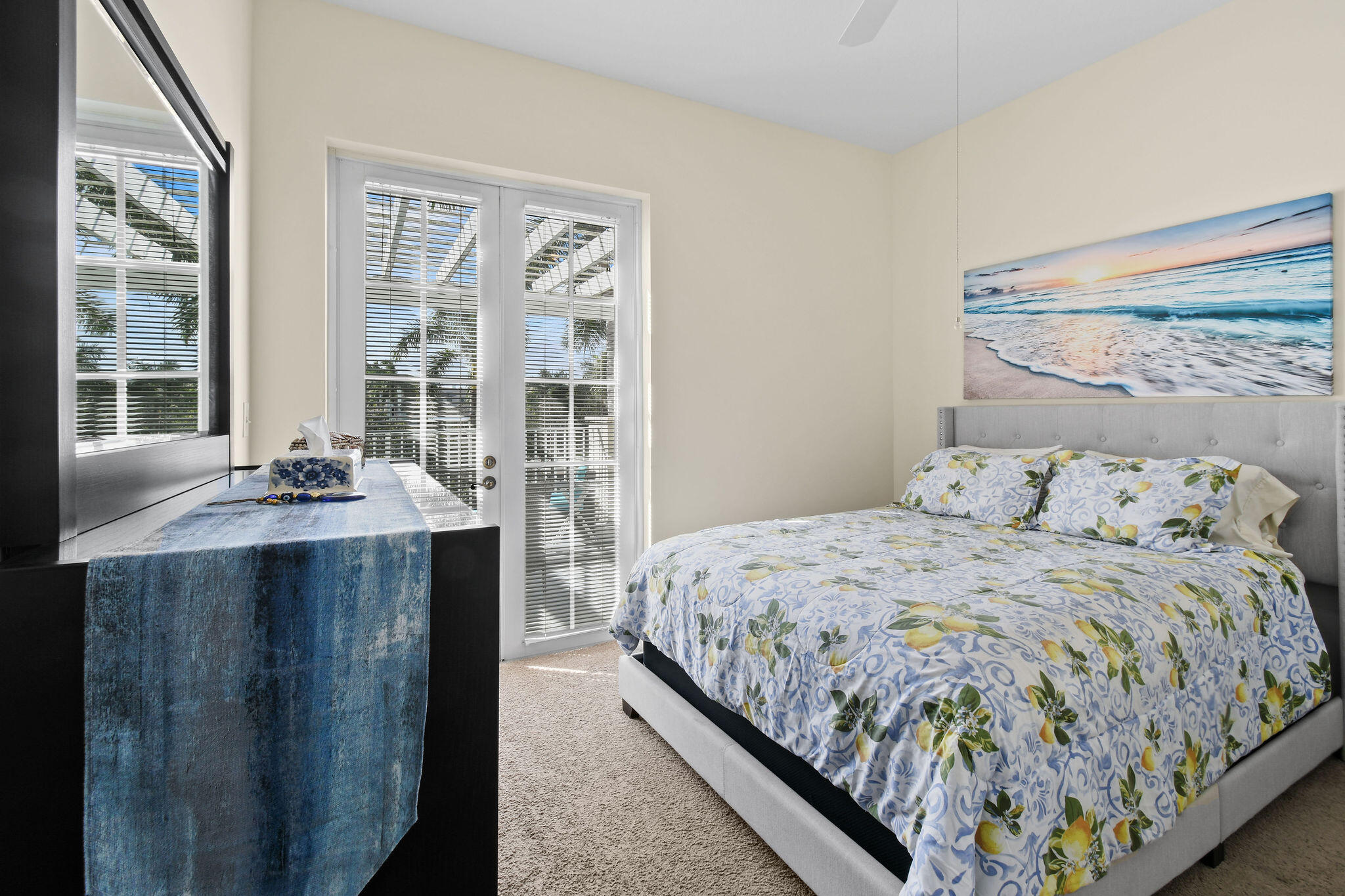 1200 Town Center Drive, Unit 326 Jupiter, FL 33458 - Photo 21 of 44 a bedroom with a bed and glass windows