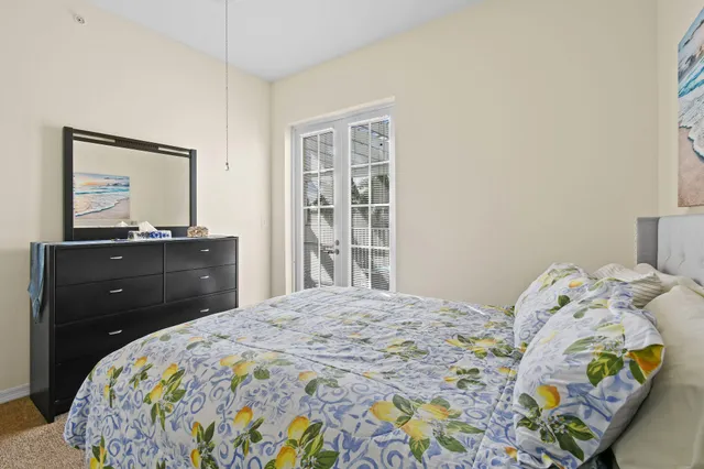 a bedroom with a bed and a dresser in it