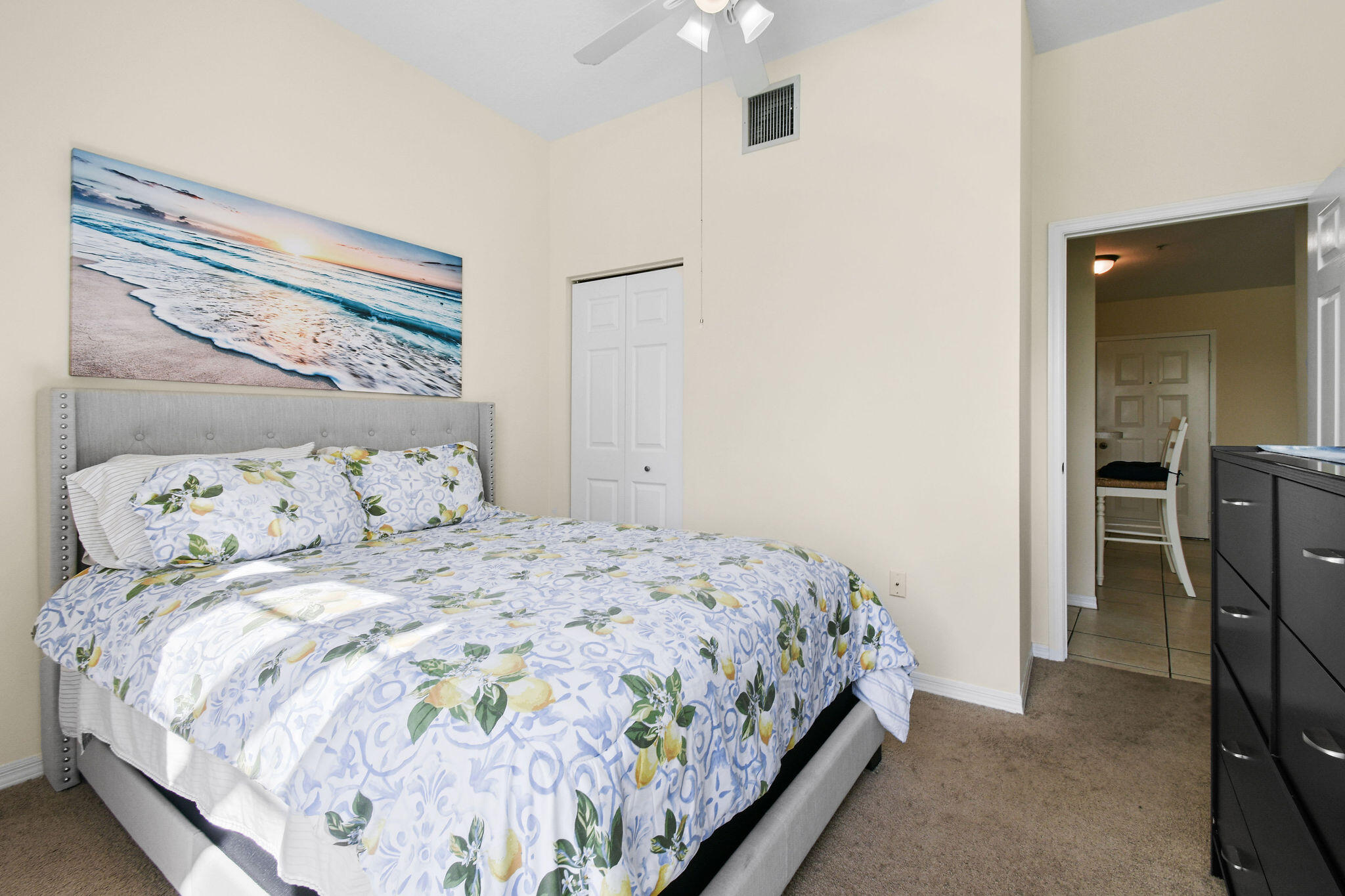 1200 Town Center Drive, Unit 326 Jupiter, FL 33458 - Photo 23 of 44 a bedroom with a bed and a mirror