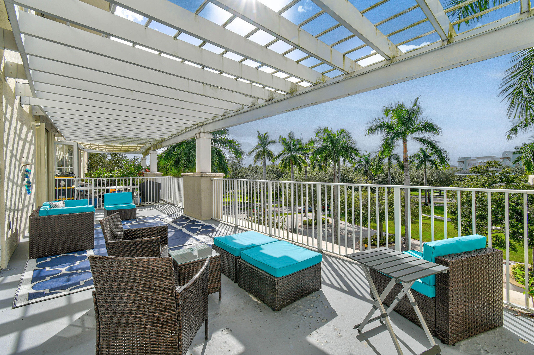 1200 Town Center Drive, Unit 326 Jupiter, FL 33458 - Photo 25 of 44 a balcony with furniture and a potted plant