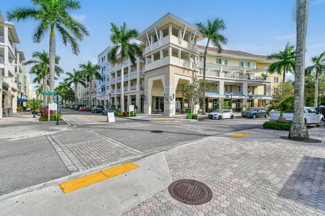 a building with palm trees in front of it