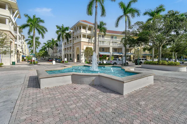 a building exterior with palm trees