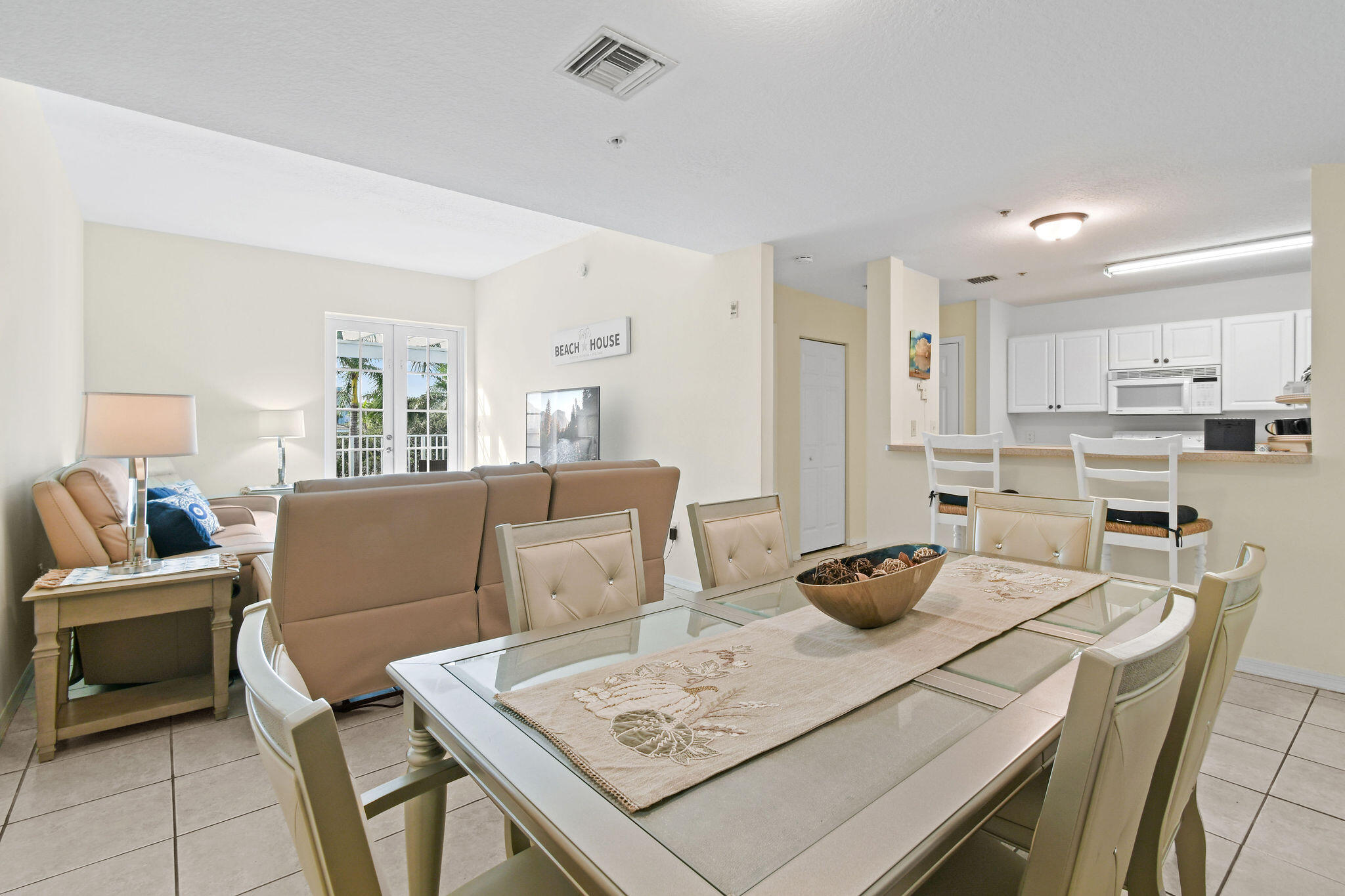 1200 Town Center Drive, Unit 326 Jupiter, FL 33458 - Photo 9 of 44 a living room with furniture and a table