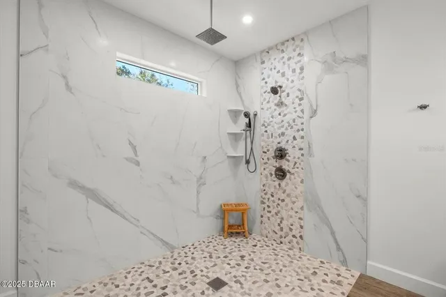 a en suite bathroom with double vanity sinks and a mirror