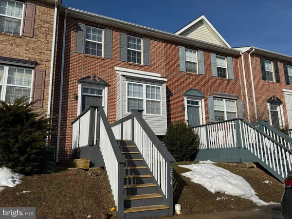 a front view of a house with a porch