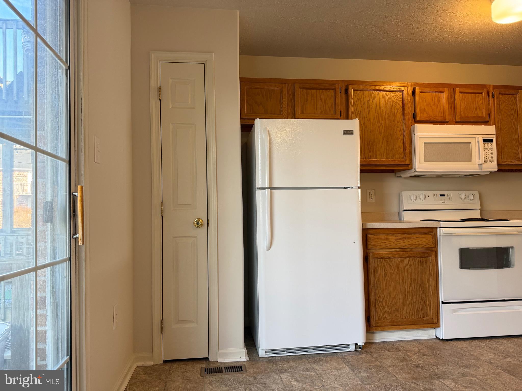 294 Mike Drive Elkton, MD 21921 - Photo 18 of 61 a white refrigerator freezer and a stove sitting inside of a kitchen